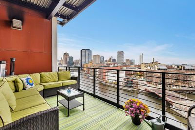 East-facing recessed balcony with gas line & electric outlet off dining room/kitchen | Image 1