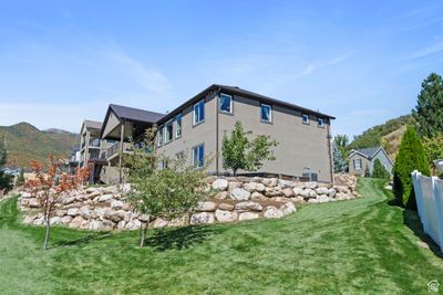 View of property exterior featuring a mountain view and a yard | Image 3