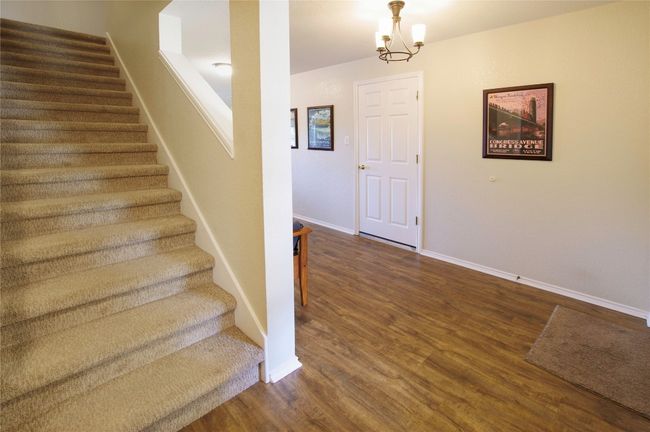Stairs off foyer with bedrooms 2, 3 and 2nd bath behind you | Image 18