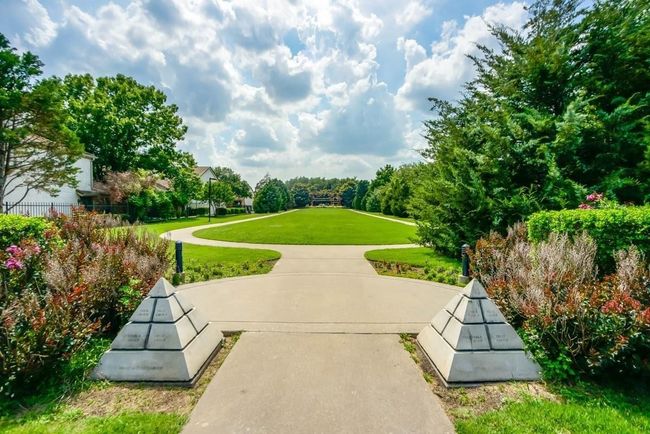 View of property's community featuring a lawn | Image 29