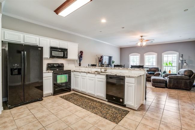 Beautiful kitchen with white cabinets and granite countertops | Image 5