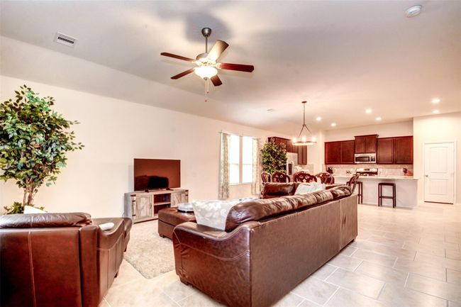 The family room is light, bright, and open! | Image 14