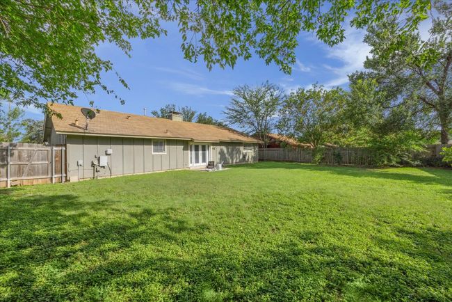 View of fenced backyard | Image 28