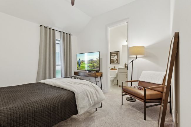 Bedroom with lofted ceiling, light carpet, and ensuite bath | Image 24