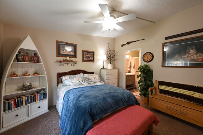 Bedroom featuring carpet, ensuite bathroom, and ceiling fan | Image 41