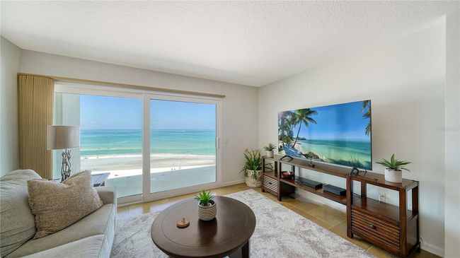 Living room with sweeping views of beach and Gulf | Image 15