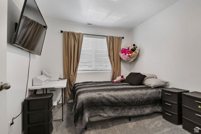 Bedroom featuring carpet flooring | Image 10