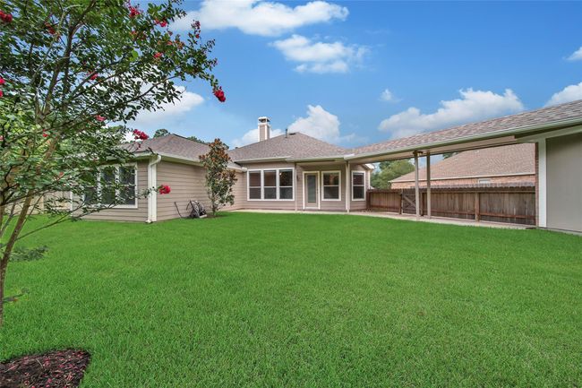 A whole home generator gives you peace of mind during storm season (located behind the garage). And the sprinkler system keeps your lawn easy to care for. | Image 26