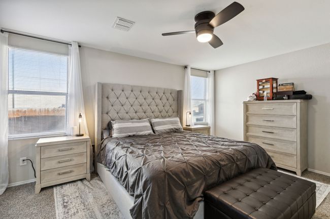 Spacious primary bedroom with natural light and ensuite bathroom | Image 13
