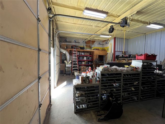 Garage featuring a workshop area | Image 36