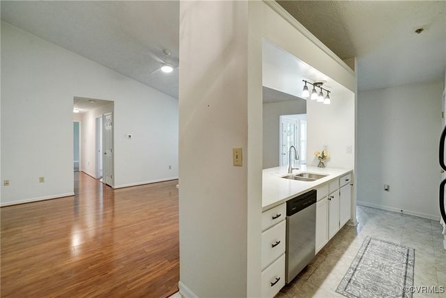 Super Cute Renovated Galley Style Kitchen! Stone Countertops, Stainless Frigidaire Appliances Convey! | Image 16