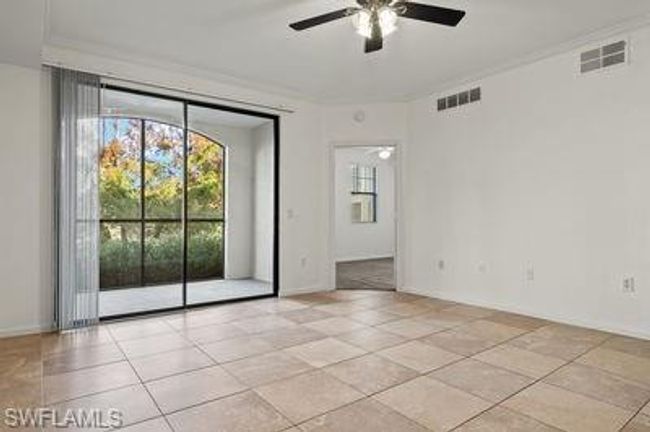 Spare room with visible vents, a ceiling fan, and light tile patterned floors | Image 7