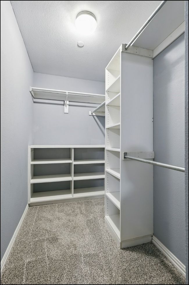 Walk in closet featuring carpet | Image 20