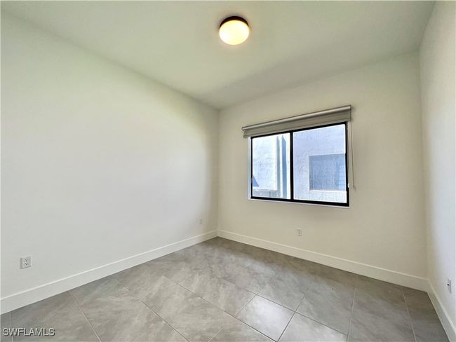View of tiled spare room | Image 24