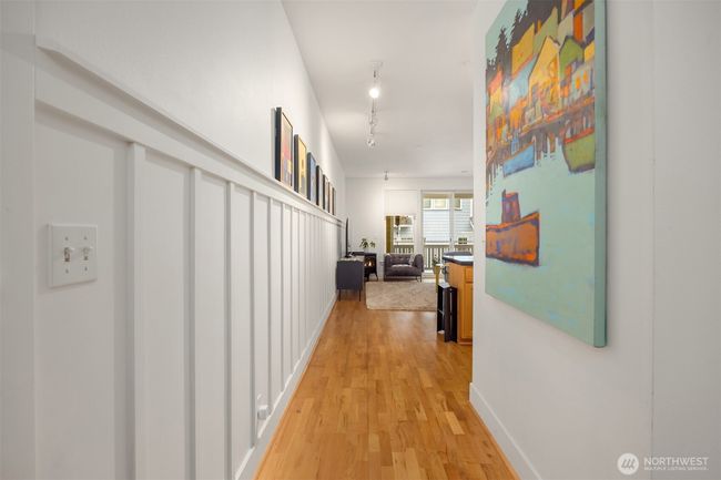 Tastefully designed with wainscoting, tall ceiling and art walls. | Image 13