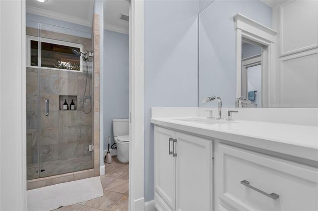 This convenient Jack and Jill bathroom offers seamless access between bedrooms, enhancing both privacy and functionality. | Image 25