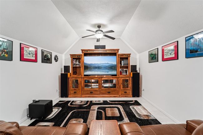 There is also a window located behind the entertainment center. | Image 37