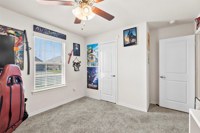 Bedroom with baseboards, carpet floors, and ceiling fan | Image 29