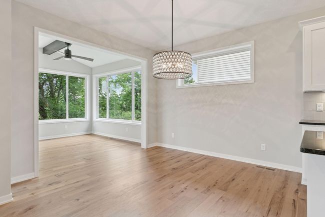 Dining room space features impressive chandelier | Image 18