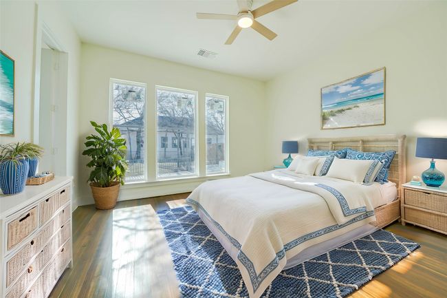 Bedroom featuring dark hardwood / wood-style flooring and ceiling fan | Image 25