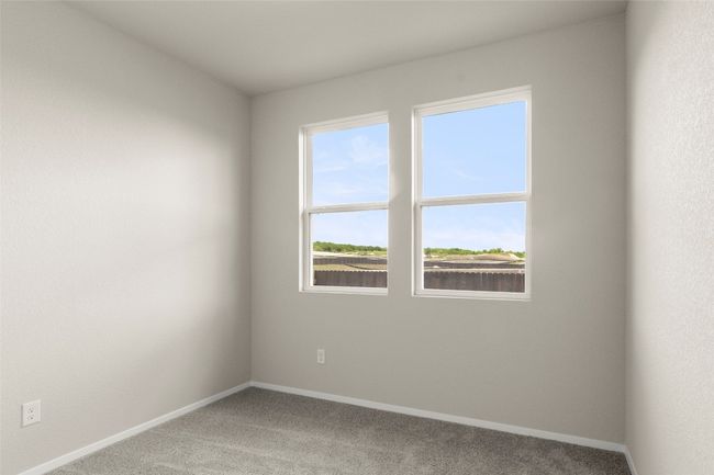 Carpeted empty room featuring baseboards | Image 28
