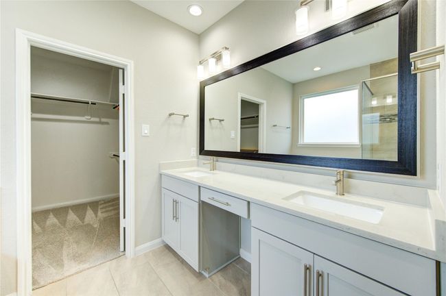 Primary bathroom with large vanity, double sinks and large walk in closet | Image 25