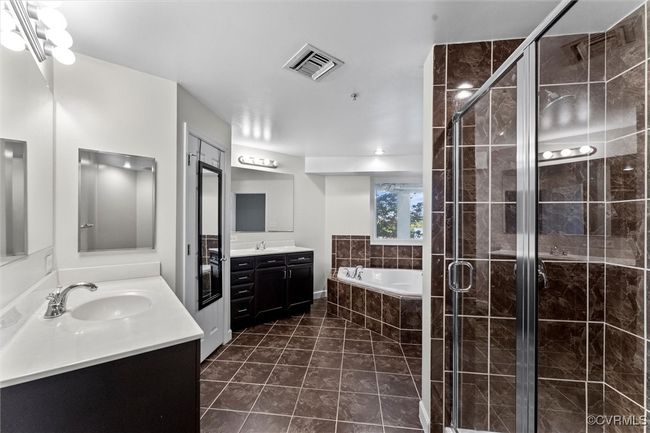 Bathroom with a garden tub, a sink, visible vents, and a stall shower | Image 33