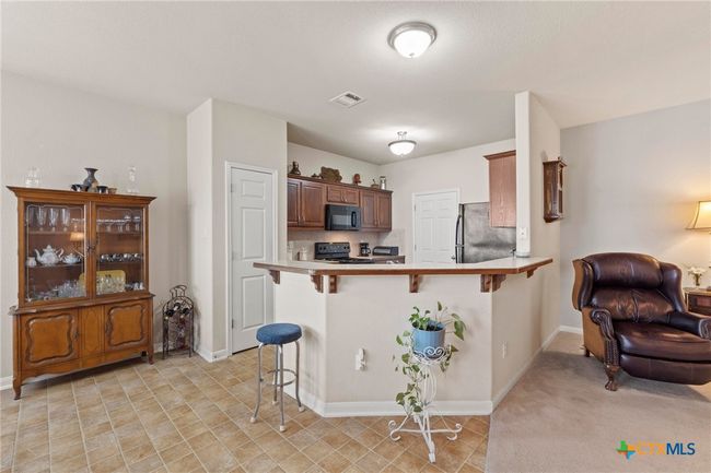 kitchen with breakfast bar | Image 8
