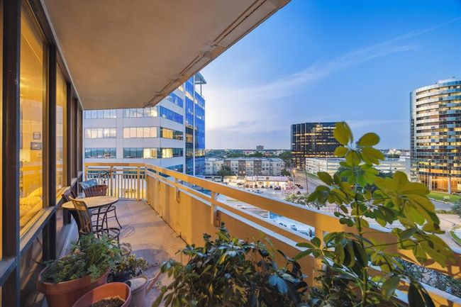 The elegant balcony provides a refined space for seating, offering sweeping views of the city skyline. | Image 25