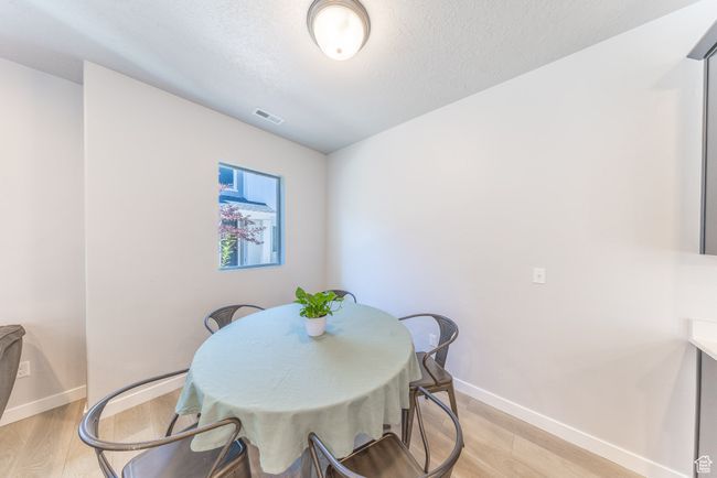 Dining room featuring light flooring. | Image 9