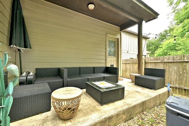 Covered back patio for extra seating | Image 19