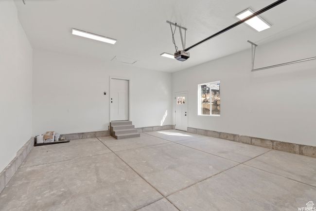 Garage featuring a garage door opener | Image 36