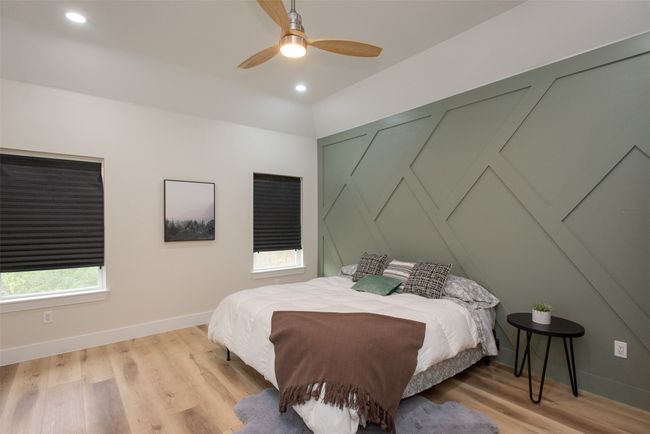 Bedroom with ceiling fan and light hardwood / wood-style flooring | Image 20