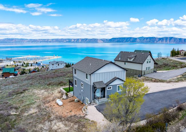 Drone / aerial view featuring a water and mountain view | Image 7