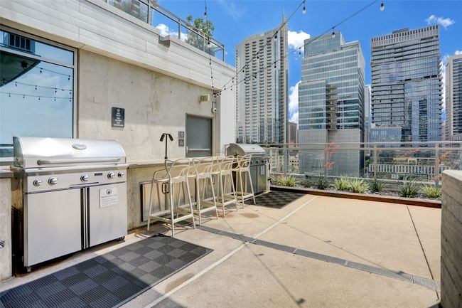 View of patio / terrace featuring a view of city and a grill | Image 29