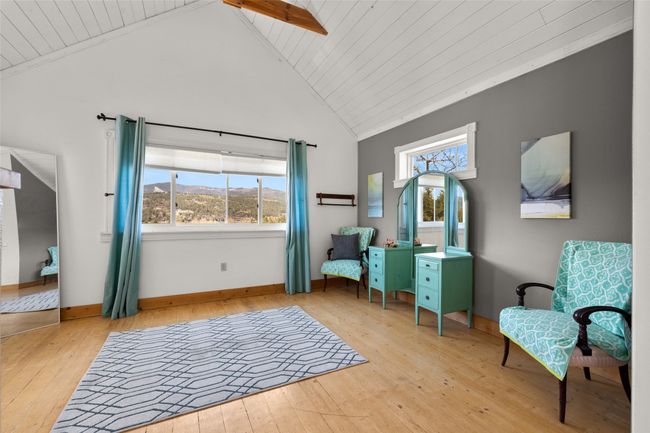 Living area featuring light wood-type flooring, plenty of natural light, and high vaulted ceiling | Image 16