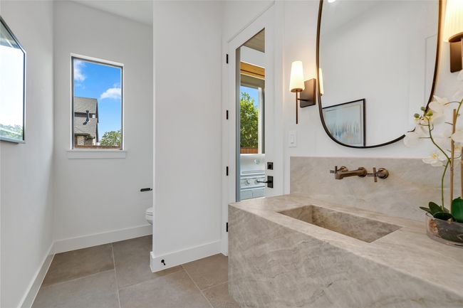 Bathroom with tile patterned floors and vanity | Image 11