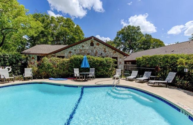 Community pool with a patio area | Image 21