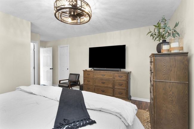 The primary bedroom provides room for a full bedroom suite and personal touches. This inviting space is ideal for creating your own sanctuary. | Image 17