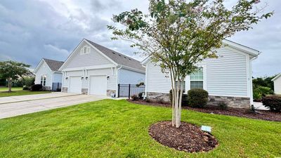 View of front of house with a front lawn and a garage | Image 2