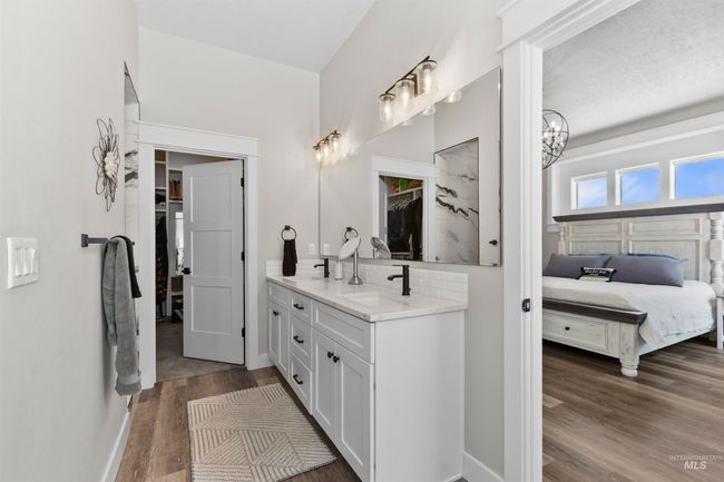 Ensuite bathroom featuring wood finished floors and double vanity | Image 27