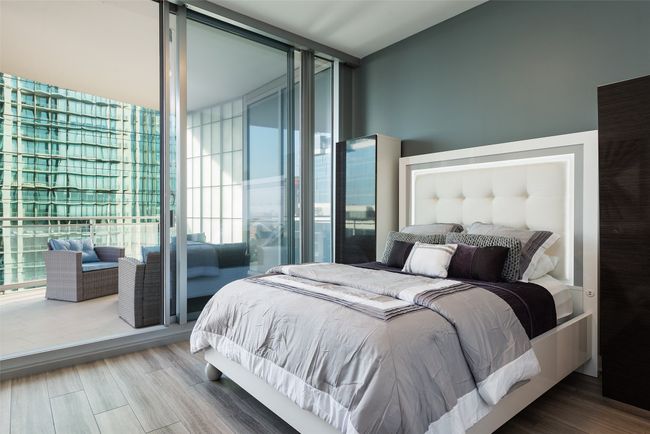 Bedroom with ensuite bathroom and balcony access | Image 19