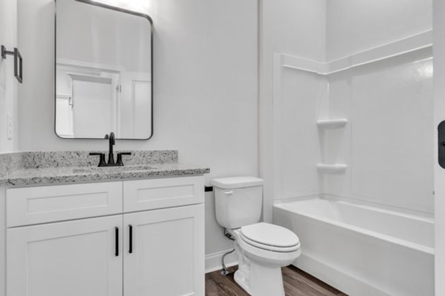 Full bathroom on the 2nd floor with modern decor, fixtures & lighting to serve guest bedroom and living area guests. | Image 13