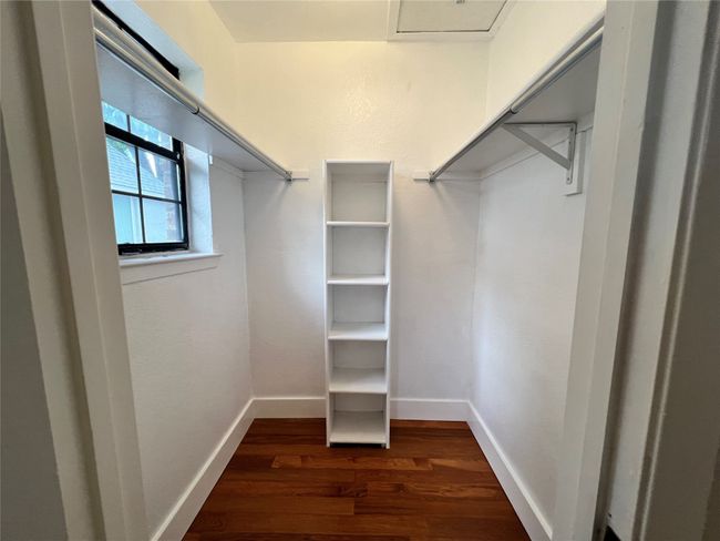 Spacious closet featuring dark wood finished floors | Image 20