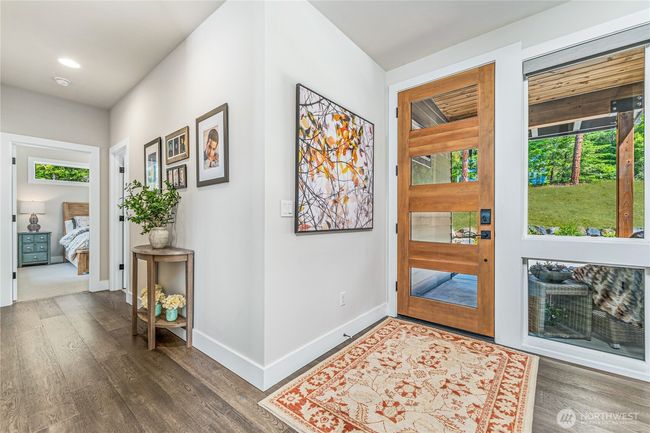 Welcome to Cle Elum mountain living at its finest—step through the striking modern entry of this luxury home and experience a perfect blend of contemporary design and natural elegance | Image 5