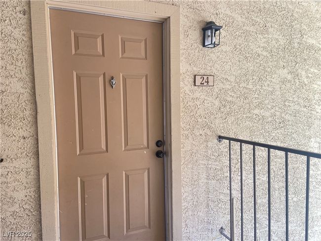 Doorway to property featuring stucco siding | Image 4