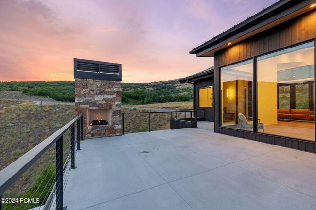 Deck with fireplace primary suite | Image 33