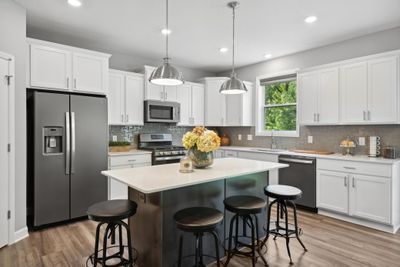 (Photo is of model home, finishes will vary) Enjoy plenty of seating at the kitchen island | Image 3