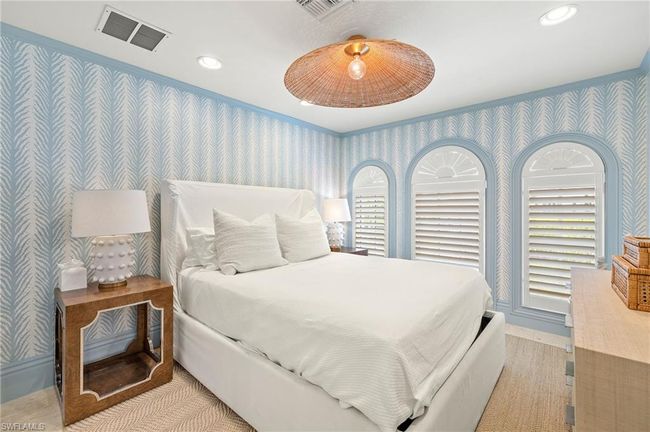 Bedroom featuring recessed lighting, wallpapered walls, ornamental molding, baseboards, and visible vents | Image 36