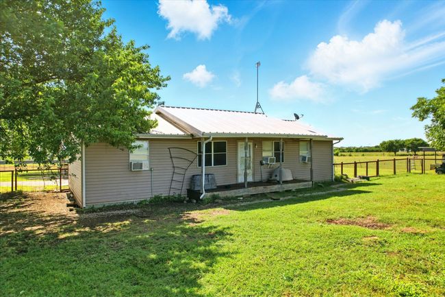 Back of house with a metal roof and covered porch | Image 14